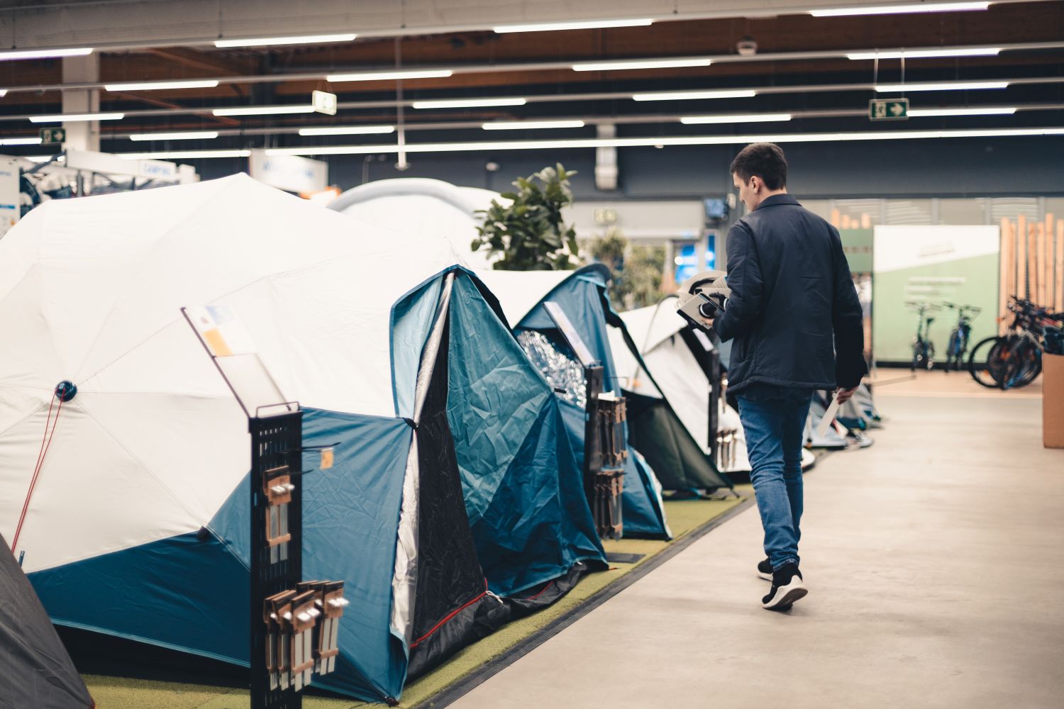 man shopping for tents